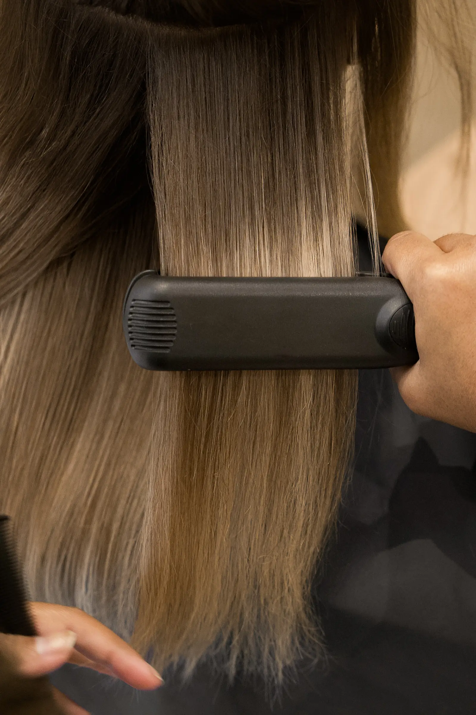 Keratin-treated hair sealed to a sleek finish