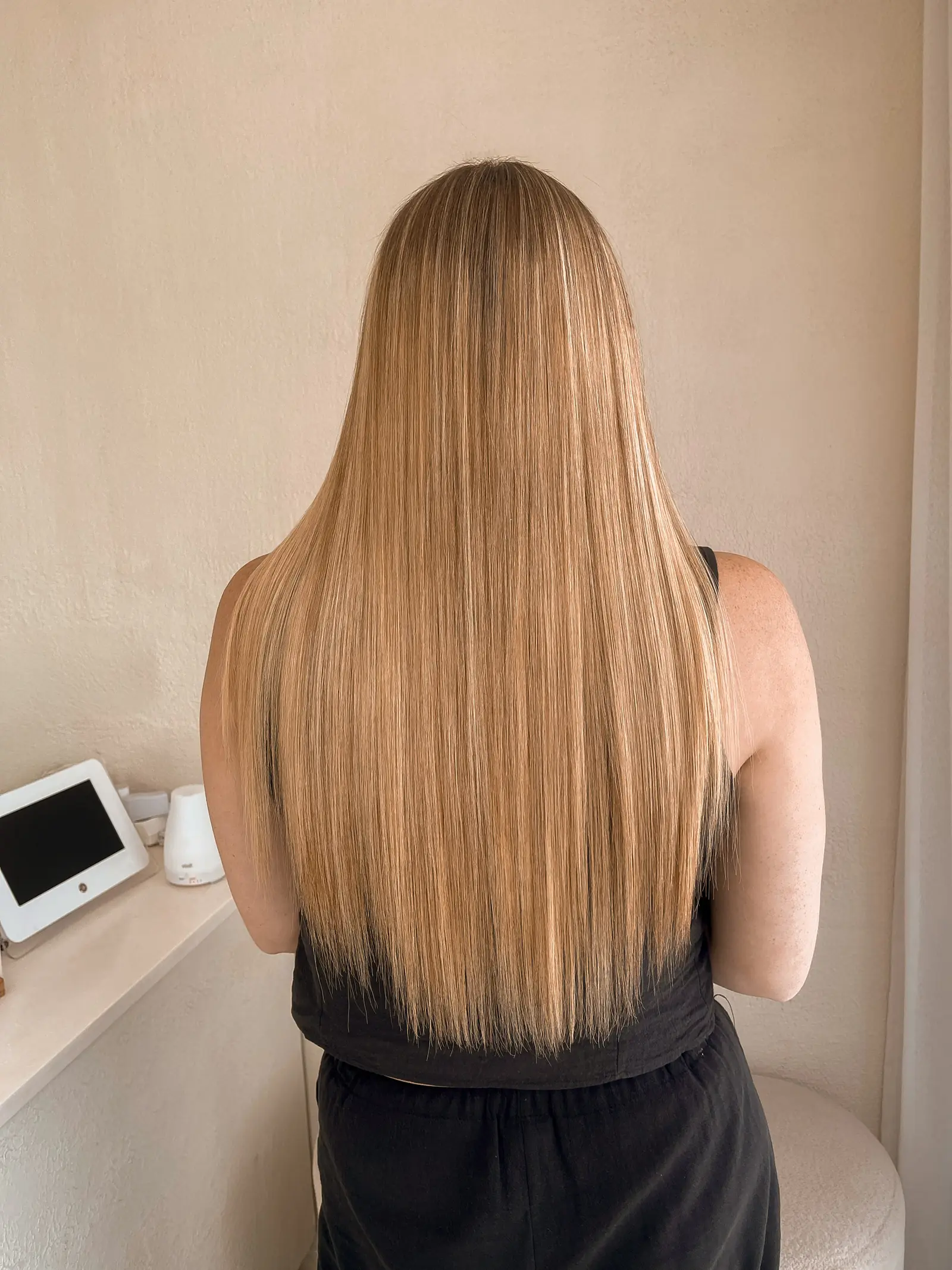The same client after her Intense Hair Keratin, straight and sleek to the ends